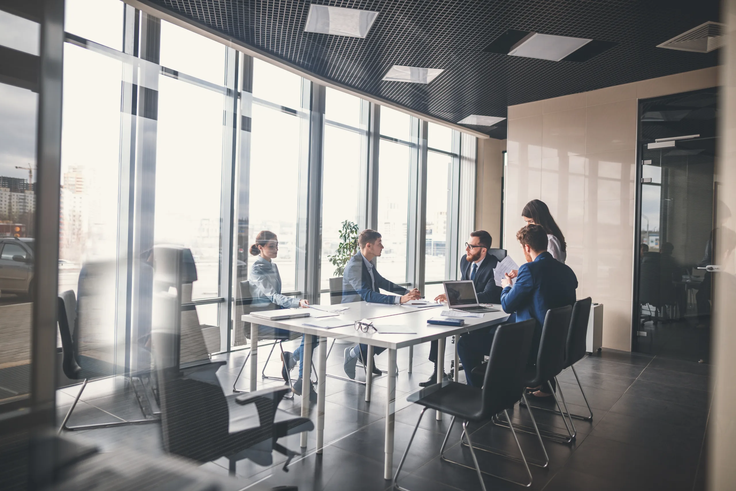 In office workers around a table having a work meeting